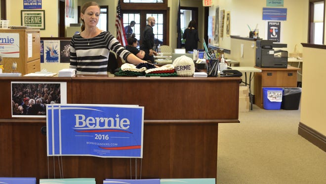 Bernie Sanders' presidential campaign headquarters on Church Street in Burlington keeps running after the candidate's endorsement of Hillary Clinton on Tuesday, July 12, 2016, as office operations director Krista Harness shows off hand-knit "Bernie" beanies.