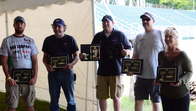 The five winners of the Two Rivers Salmon Derby pose for a picture after an awards ceremony at Walsh Field on Sunday. The winners were, from left to right, Josh Kintgen, Leon LeCait, Evan Haupt, Glenn Kappletman and Deb Hoffman.