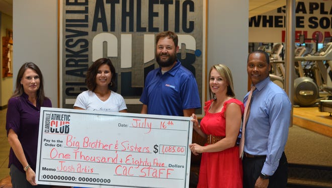 Picture (left to right): Amy Carroll, Executive Director of Big Brothers Big Sisters of Clarksville; Heather Greathouse, Office Manager Clarksville Athletic Club; Denny Fry,  Board Member of Big Brothers Big Sisters of Clarksville; Heather Brooks, Spouse of Charlie Brooks and Charlie Brooks, Tournament Director at the Athletic Club hold a check that was presented to Big Brothers Big Sisters by the Clarksville Atheltic Club after money was donated during the Athletic Club's court dedication ceremony last month that honored Josh Artis.