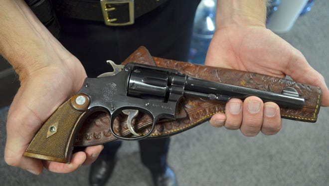Great Falls Police Chief Dave Bowen holds a 1937 Smith & Wesson .38-caliber pistol, which was returned this week to the Great Falls Police Department after 80 years.