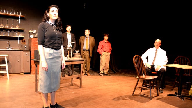 Actors in a scene from the play "Photograph 51" opening at the Black Box Theatre on Friday.