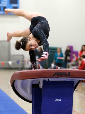 Molly O' Boyle of Kenosha Combined competes on the vault during the 16th Annual Warhawk Invite gymnastics meet.
