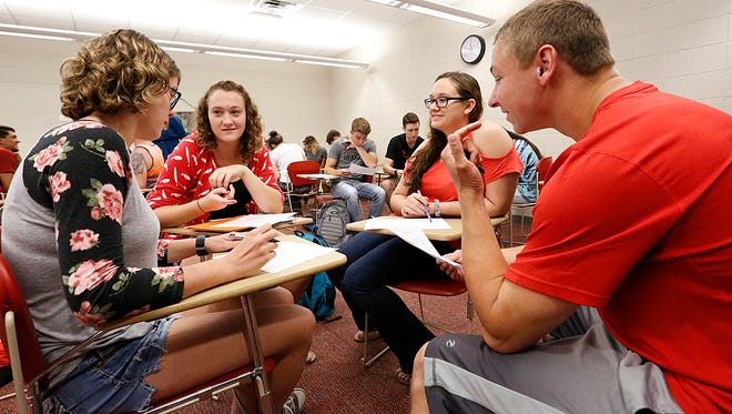 Ripon College students Janet Koehler, Haley Stowell, Kim Sipple and Tyler Nelson discuss different ways to total votes during a Catalyst class Wednesday August 23, 2017. The innovative program teaches students skills they will need to maneuver in today's workforce. Doug Raflik/USA TODAY NETWORK-Wisconsin