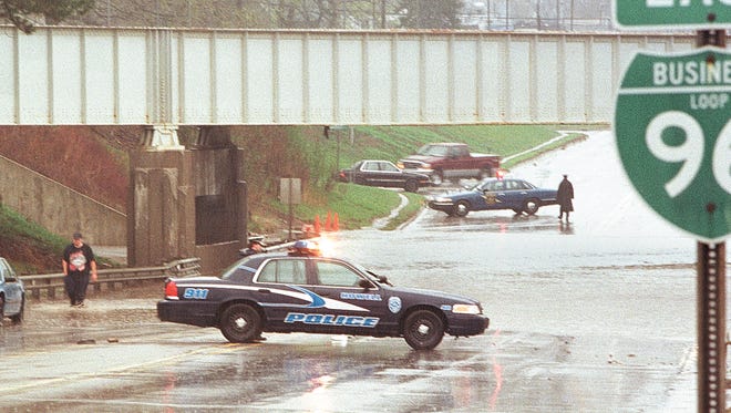 In a file photo from April of 2000, a span of Grand River under a railroad viaduct at the border of Genoa and Oceola townships is flooded, a problem that has periodically occurred for decades.