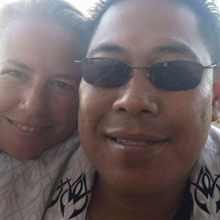 Cloyd Edralin, right, a green card holder who has lived in the U.S. for 30 years, poses for a picture with his wife, Brandi Davison-Edralin. Edralin was detained by immigration officers Monday morning over an 11-year-old firearm conviction.
