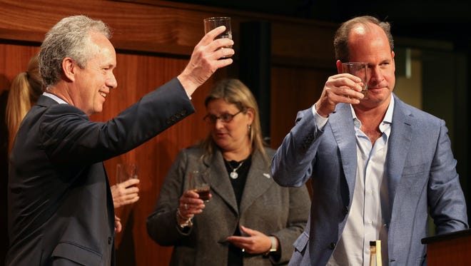 Mayor Greg Fischer and Old Forester President Campbell Brown toast  at the unveiling and announcement of the Statesman, part of the Kingsman movie franchise, based around the bourbon industry in Louisville on Monday morning.May 1, 2017