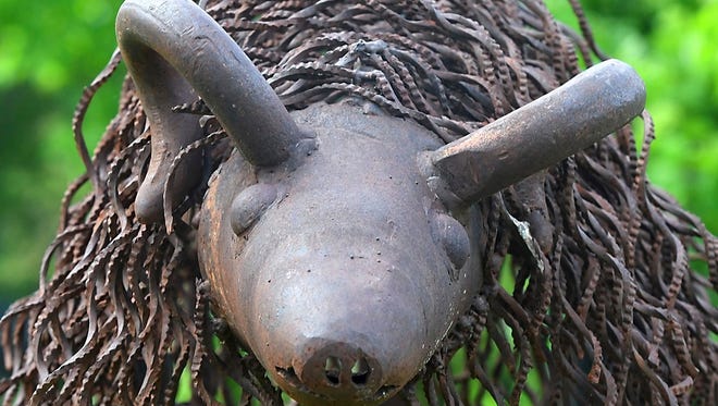 This May 23, 2018 photo shows a ram, made from unusually curled scraps of metal found in a scrap yard by artist Dick Sonnek in Mapleton, Minn. The horns originally were tow rings on a truck.