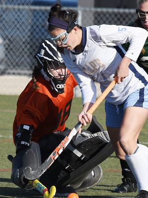 Tess Bernheimer (right) and Cape Henlopen won their fifth-straight state field hockey title.