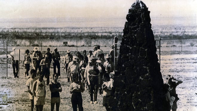 Crowds gather around a monument marking ground zero of the first atomic explosion in the White Sands Missile Range in New Mexico on July 16, 1945. The site, known as Trinity Site, is opened to the public twice a year.