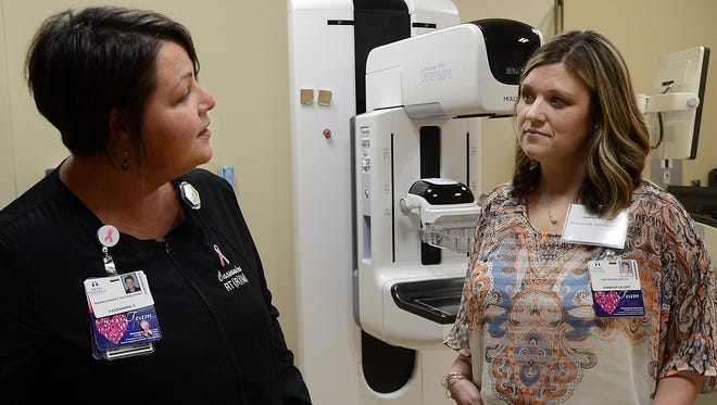 Mammography technician, Cassandra Carter, left, chats with Imaging Services Manager, Jennifer Valenti near Ascension Medical Center's 3-D mammography unit during an open house May 5, 2017.