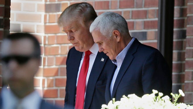 In this July 13, 2016 photo, Republican presidential candidate Donald Trump leaves the Indiana Governor's residence with Gov. Mike Pence in Indianapolis. Trump has chosen Pence as his running mate, adding political experience and conservative bona fides to his Republican presidential ticket. Trump announced his decision on Twitter Friday, July 15, 2016, capping a frenzied 24 hours of speculation about his choice.