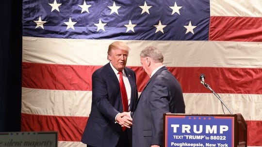 Donald Trump greets Dutchess County Sheriff Butch Anderson during a rally at the Mid-Hudson Civic Center in Poughkeepsie on April 17, 2016.