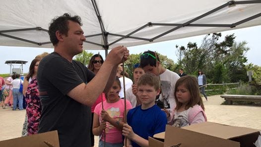 Asbury Park Press reporter Dan Radel demonstrates how to make a bamboo fishing pole at last year's Ocean Fun Days event at Island Beach State Park.