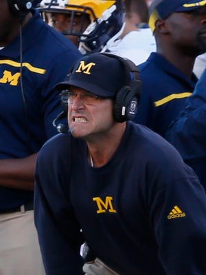Michigan head coach Jim Harbaugh on  the sidelines in the first quarter against Utah in their football game at Rice-Eccles Stadium on Thursday, September 03, 2015, in Salt Lake City, Utah.