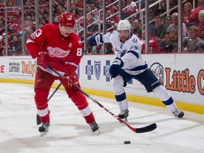 Detroit center Tomas Nosek tries to keep the puck away