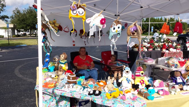 A regular at the Treasure Coast Deaf Church Craft Fair, Tammy and her daughter Savannah are all set up with beautiful arts of work.