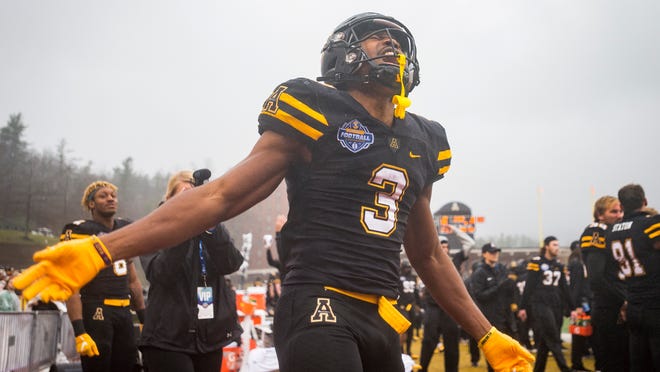 Appalachian State running back Darrynton Evans (3) celebrates in the closing moments of Appalachian State's victory over Louisiana in the Sunbelt Championship on Saturday, Dec. 1, 2018 in Boone, N.C.  (Andrew Dye/The Winston-Salem Journal via AP)