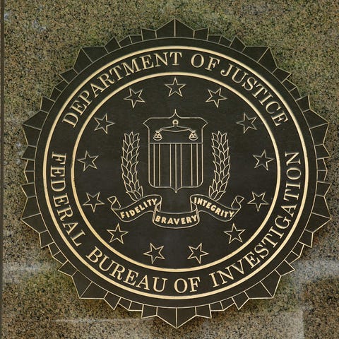 The FBI logo is seen outside the headquarters...