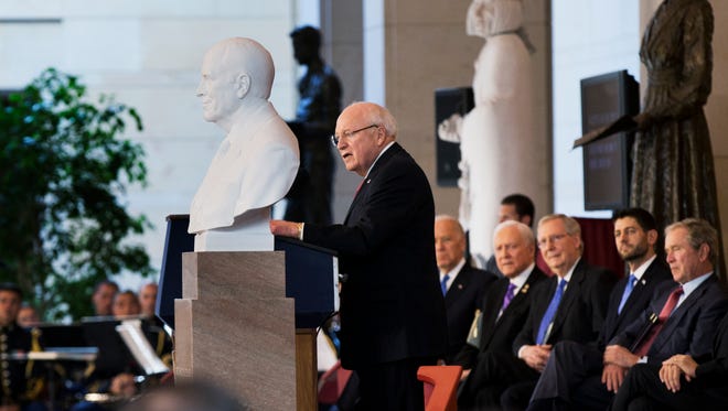 Former Vice President Dick Cheney speaks in Emancipation Hall on Capitol Hill in Washington, Thursday, Dec. 3, 2015, during the unveiling of his marble bust, left. Listening are, from second from left, Vice President Joe Biden, Sen. Orrin Hatch, R-Utah, Senate Majority Leader Mitch McConnell of Ky., House Speaker Paul Ryan of Wis., and former President George W. Bush.