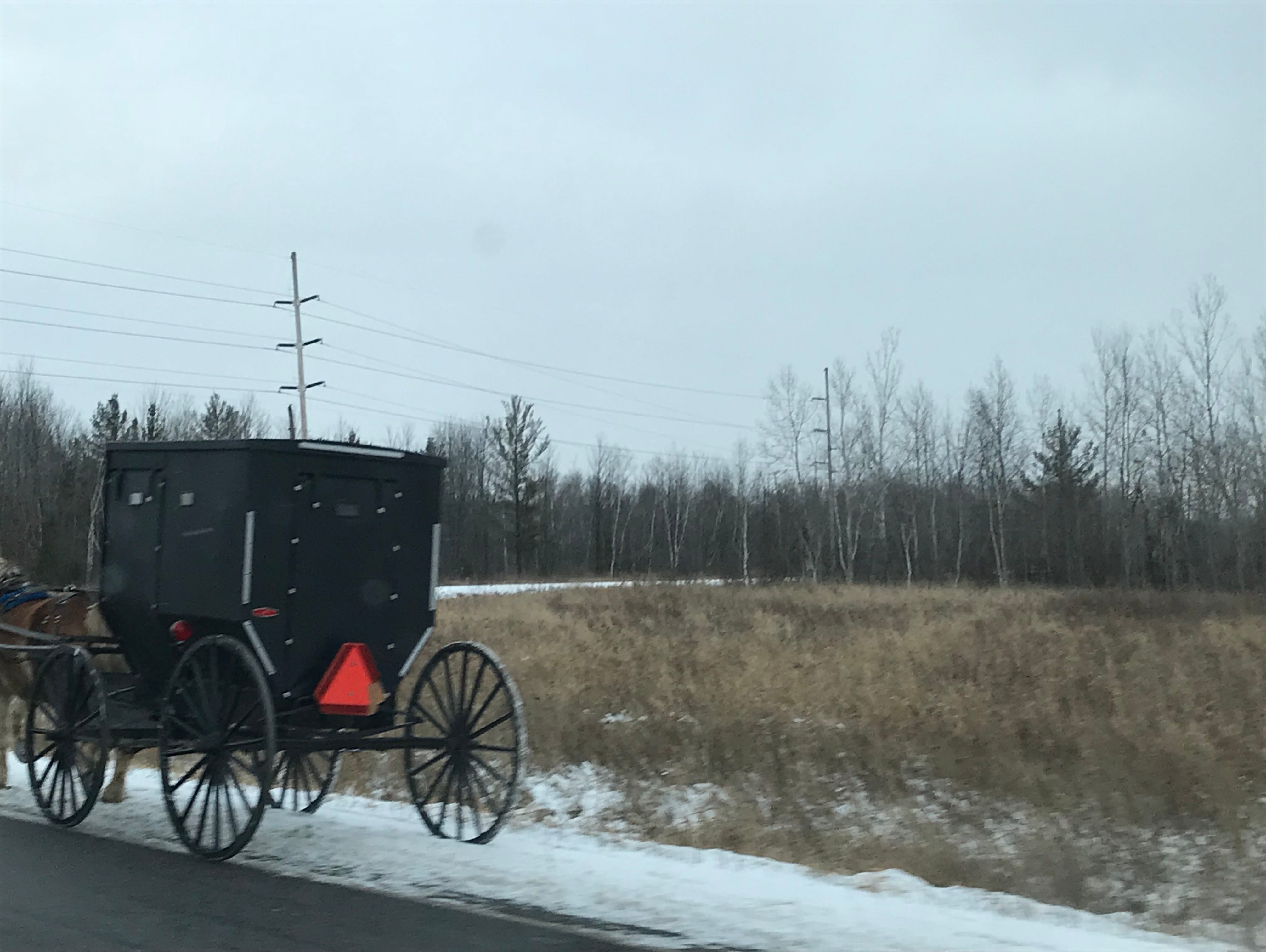 A new reflective triangle, reflective tape and red lights on a buggy in Wood County Friday morning shows signs that efforts to improve safety are having some effect.