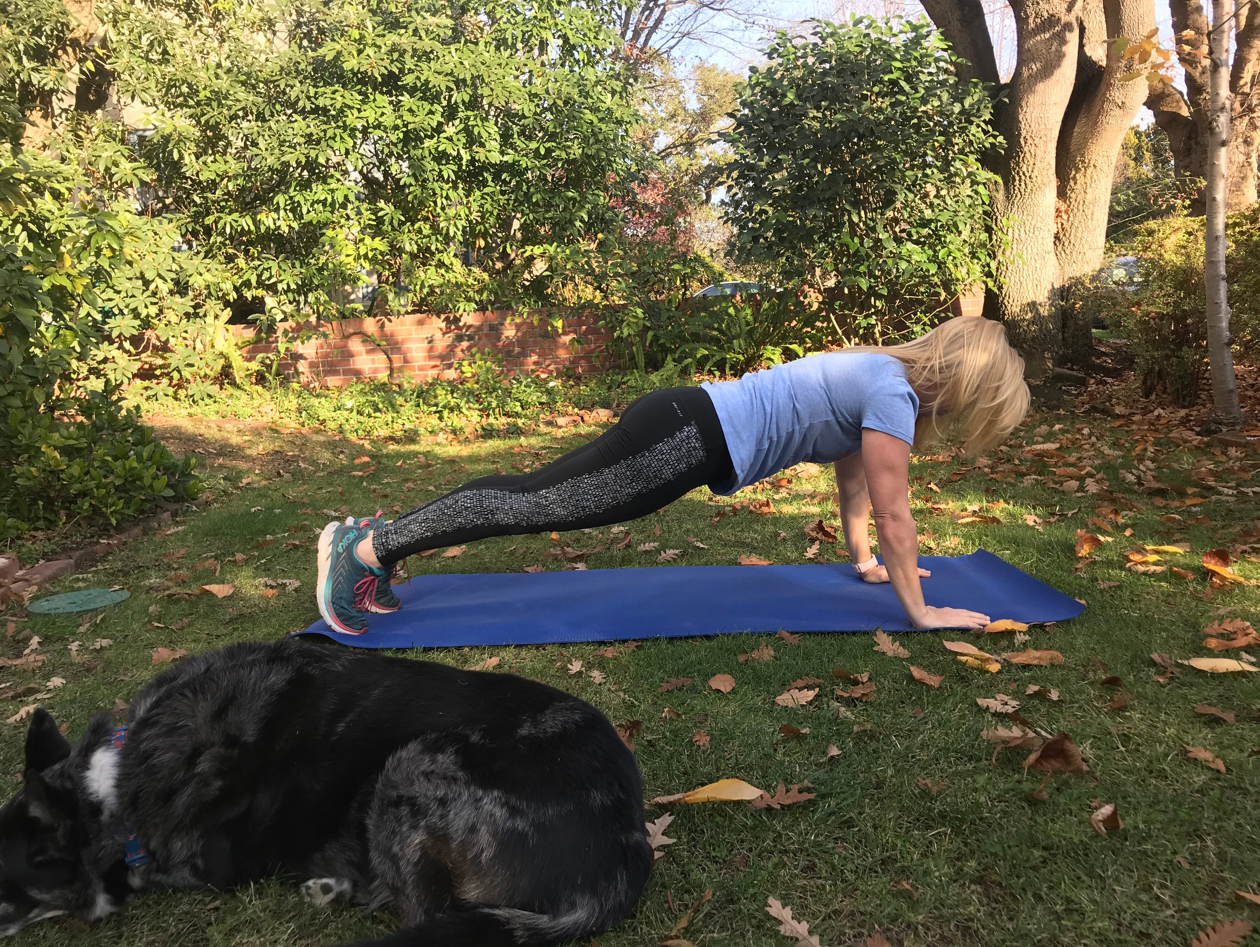 Columnist Jennifer Jolly doing plank exercises.