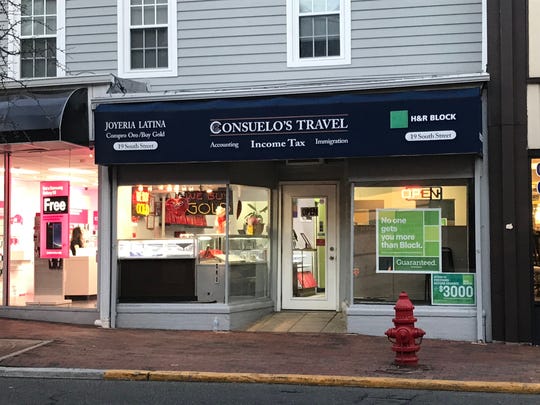 Consuelo's Travel in Freehold Borough advertises immigration