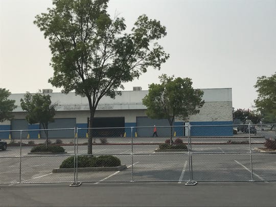 A fence has gone up around the old Sears store in the