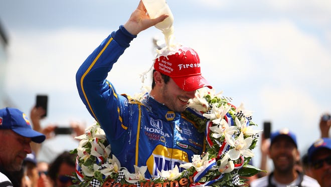 Alexander Rossi, driver of the #98 NAPA Auto Parts Andretti Herta Autosport Honda, celebrates after winning the 100th running of the Indianapolis 500 at Indianapolis Motorspeedway on Sunday in Indianapolis, Ind.