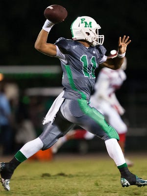 Fort Myers High School quarterback Dylan Degroot passes against North Fort Myers during second quarter play Friday (9/5/14) at Fort Myers High School.