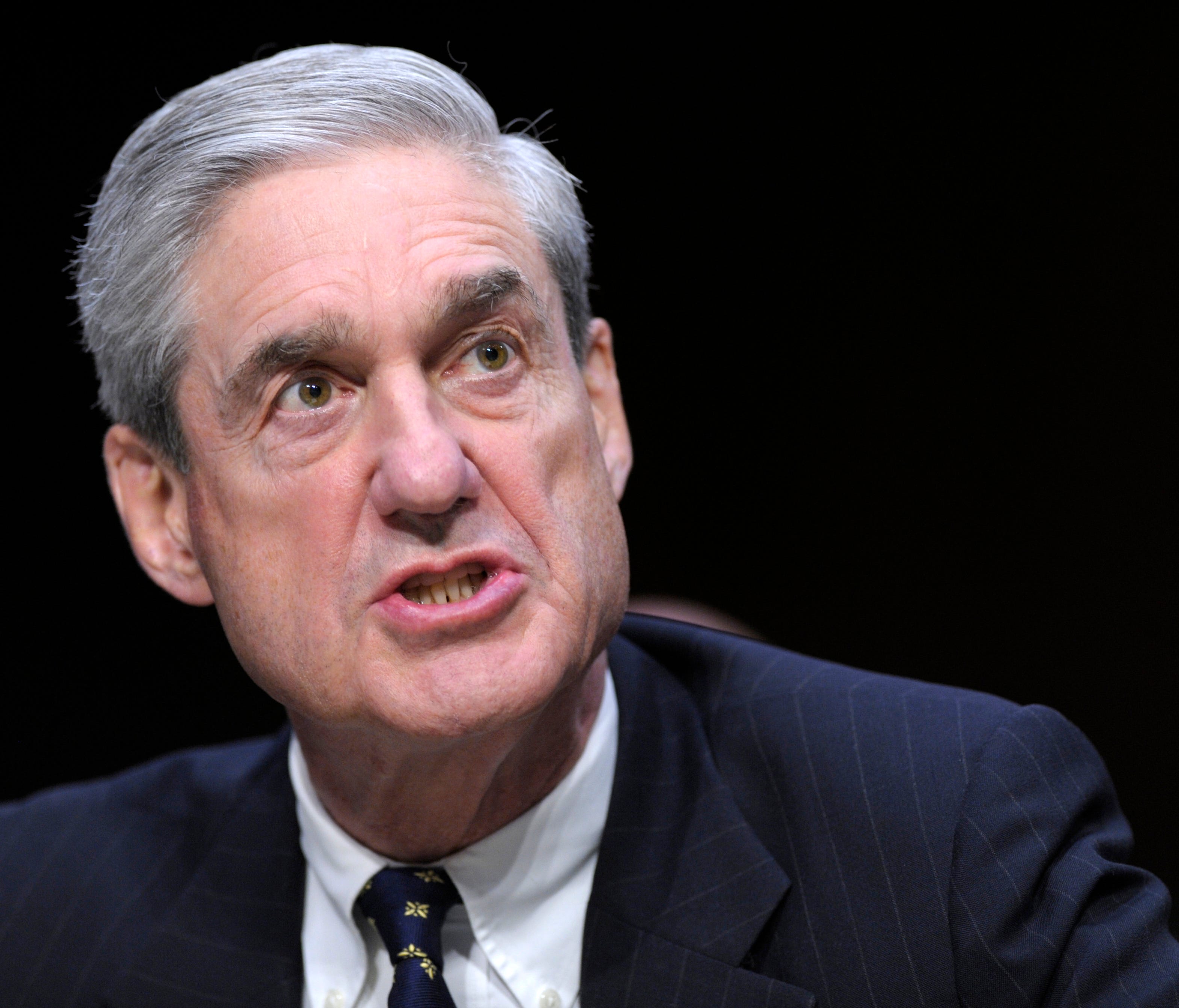In a 2013 file photo, then-FBI Director Robert Mueller testifies on Capitol Hill