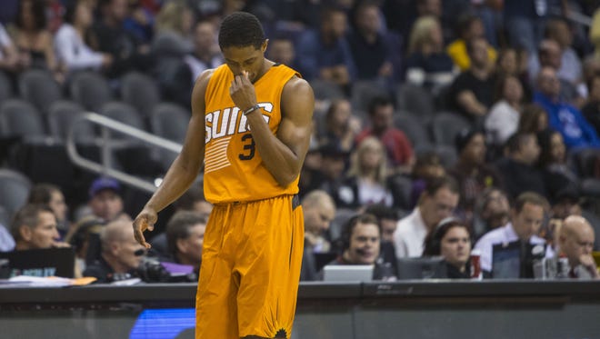 Suns' Brandon Knight heads back to the bench during a timeout during Star Wars night at Talking Stick Resort Arena on Dec. 11, 2015 in Phoenix, Ariz. Knight finished with one point on 0 for 12 shooting.