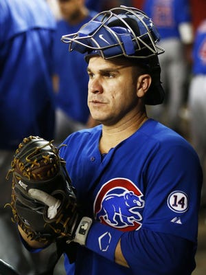 Catcher Miguel Montero of the Chicago Cubs prepares to warm-up the pitcher Jon Lester in the 7th inning on Friday, May 22, 2015 at Chase Field in Phoenix, AZ.