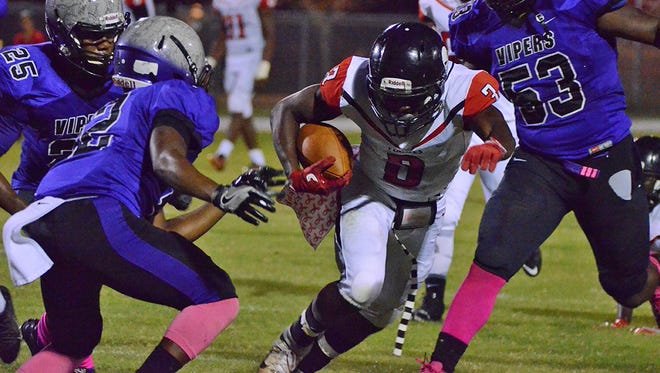 Desmond Arthur carries the ball for Palm Bay on Friday night at Space Coast.