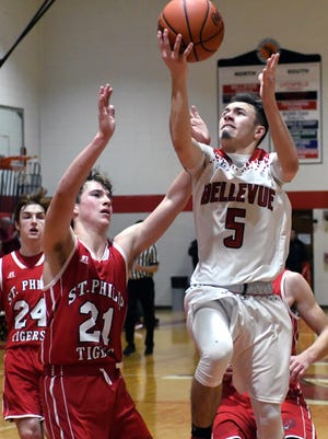 Bellevue's Wyatt Waterbury (5) drives the basket during game action Tuesday night.