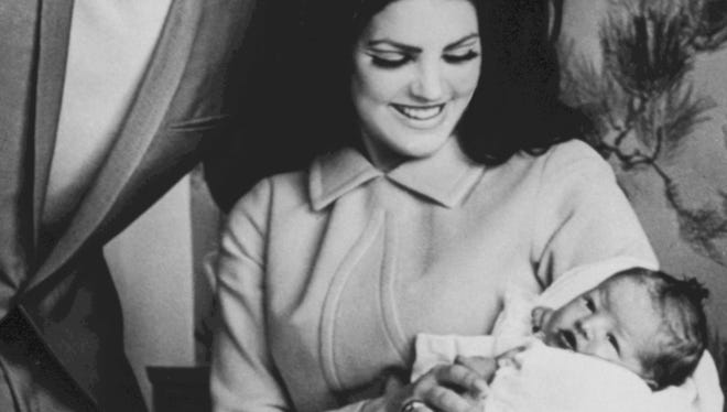 Elvis and Priscilla Presley with newborn Lisa Marie, 1968