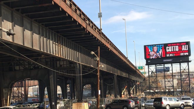 Decrepit Rte. 495  viaduct now under repair above NJ Transit park & ride in North Bergen.
