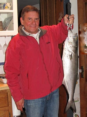 Bill Dalton, Interlaken, with a bluefish he caught in the Deal surf on Nov. 18.