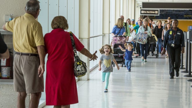 This photo, taken in March of this year, shows a family welcome at Southwest Florida International. You can expect to see more of these at the airport during the upcoming end-of-year holidays.
Ally Moneypenny, 4, and her sister Brooklyn, 2, run to hug great grandma and great grandpa, Tom and Jean Steel, of Lely. They were coming from Michigan. March brings madness and longer lines to RSW.
Ally Moneypenny, 4, and her sister Brooklyn Moneypenny, 2, run to hug great grandma and great grandpa, Tom and Jean Steel of Lely. They were coming from Michigan. March brings madness and longer lines to RSW. As visitors come and go for vacations, spring break, and baseball, these reasons all contribute to help make March, historically the busiest month at the 32-year-old airport.
