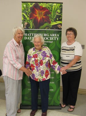 Charter members of the Hattiesburg Area Daylily Society celebrated the 25th anniversary of the founding of the organization.  Charter members in attendance were, from left, Marty DeBolt of Bush, Louisiana; Mary Lois Burkett of Hattiesburg; and Penny Stringer of Oloh. Burkett has one of the largest daylily gardens in Hattiesburg, and continues to work in it at age 103.