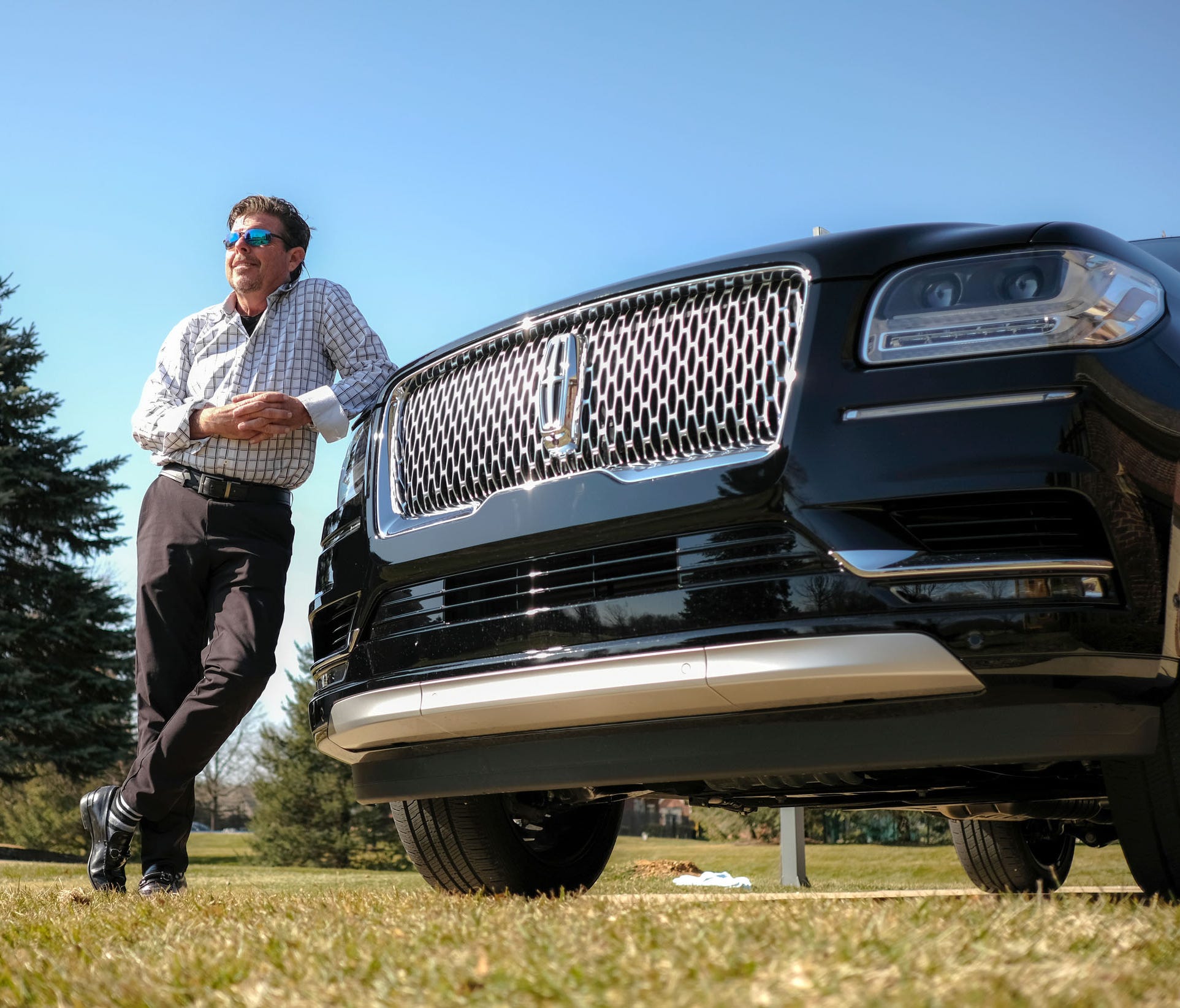 Joey Maruskin with his 2018 Lincoln Navigator L Black Label SUV at his home in Highland Township on Wednesday, February 28, 2018.