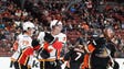 Oct. 9: Calgary Flames center Sean Monahan (center)