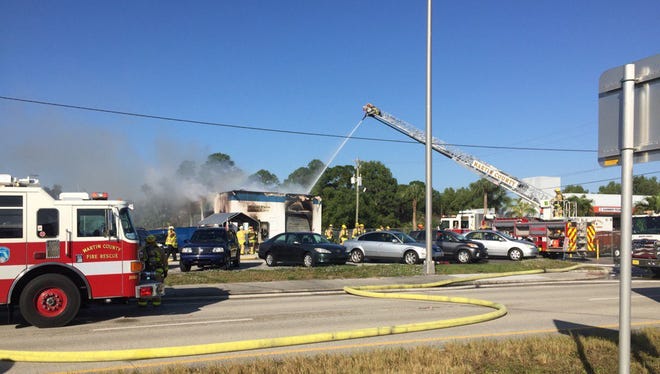 A structure fire burns on Kanner Highway near Salerno Road on Friday, Dec. 2, 2016 in Stuart.
