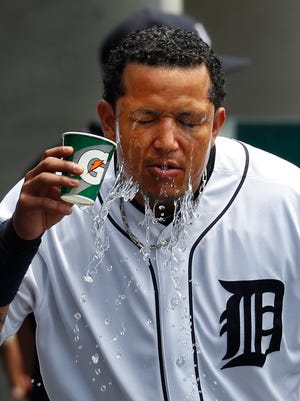 Tigers' Miguel Cabrera pours water on himself during a game against the White Sox in Detroit, Sunday, June 4, 2017.