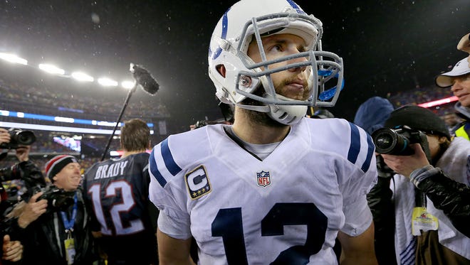 Indianapolis Colts quarterback Andrew Luck walks away from New England Patriots quarterback Tom Brady after the game. The Indianapolis Colts play the New England Patriots in the AFC Championship game Sunday, January 18, 2015, at Gillette Stadium in Foxborough MA.