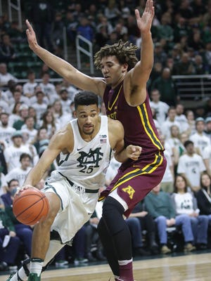 Michigan State forward/center Kenny Goins drives against Minnesota center Reggie Lynch during the first half of MSU's 65-47 win Wednesday, Jan. 11, 2017 at Breslin Center.