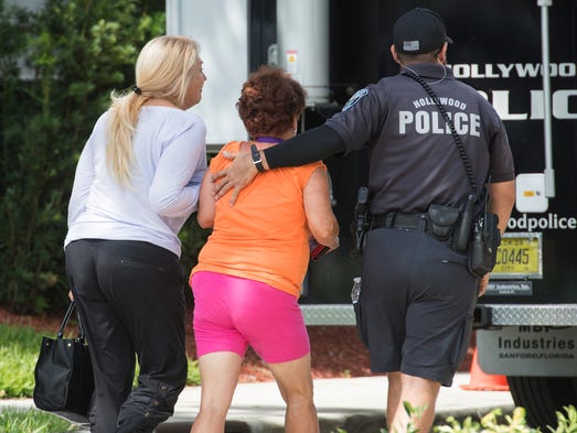 Hollywood Police direct people arriving on the scene