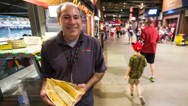 June 1, 2014 - Rey Cota holds tamales that he sells at his tamale booth at Diamondbacks Games in Chase Field.
