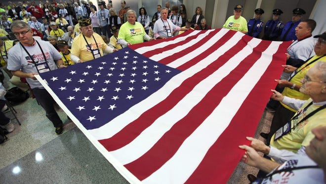 World War II and Korean War veterans took part in a flag dedication in October 2013 at Cincinnati/Northern Kentucky International Airport prior to their  journey to Washington, D.C., to see their war memorials.