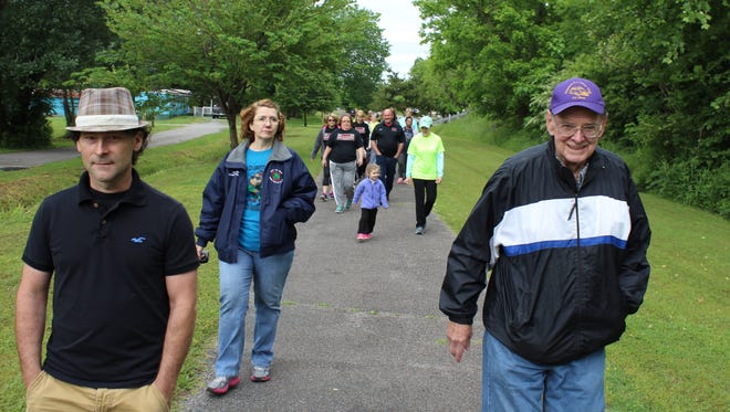 Mayor Paul Bailey and Ben Hagler lead the pack walking during the Marathon in a Month kickoff.