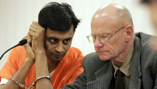 Manishkumar M. Patel (left), 34, of Kaukauna, sits with his attorney, Thomas Zoesch during a court appearance Nov. 29, 2007, in Appleton. Patel, who is accused of attempted first-degree intentional homicide of an unborn child, fled after posting a $750,000 cash bond.